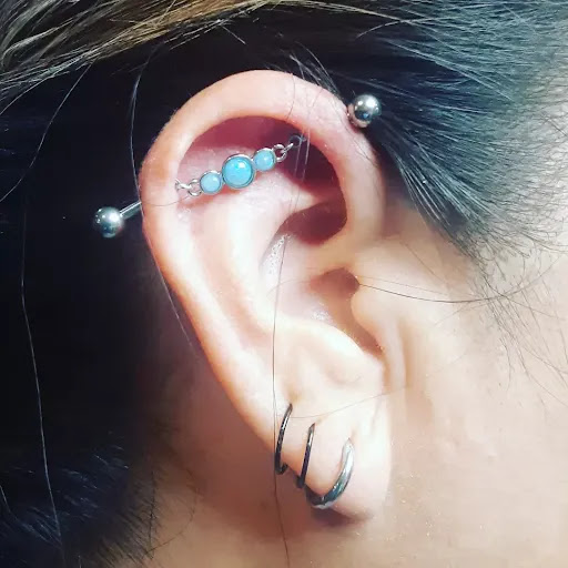 Explore fishnet tattoo ideas, creative tattoo ideas in El Paso, available at Whiskeys piercings