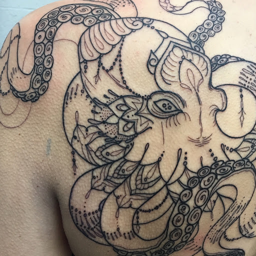 Explore armband tattoo ideas for men, creative tattoo ideas in Scipio Center, available at Ace of Wands Private Tattoo & Tarot Studio . Appointment Only