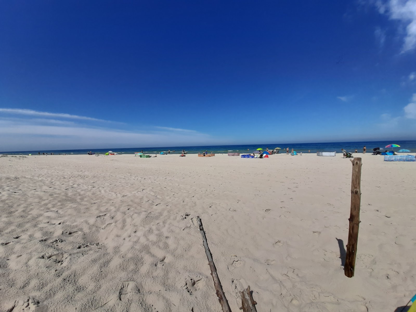 Fotografija Cholpin Beach II z svetel pesek površino