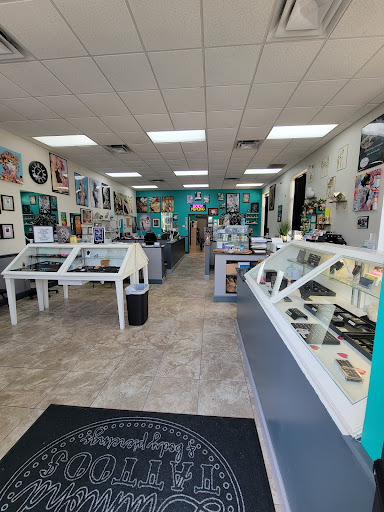 Explore rose vine tattoo ideas, creative tattoo ideas in Summerfield, available at Diamond Tattoos & Body Piercings