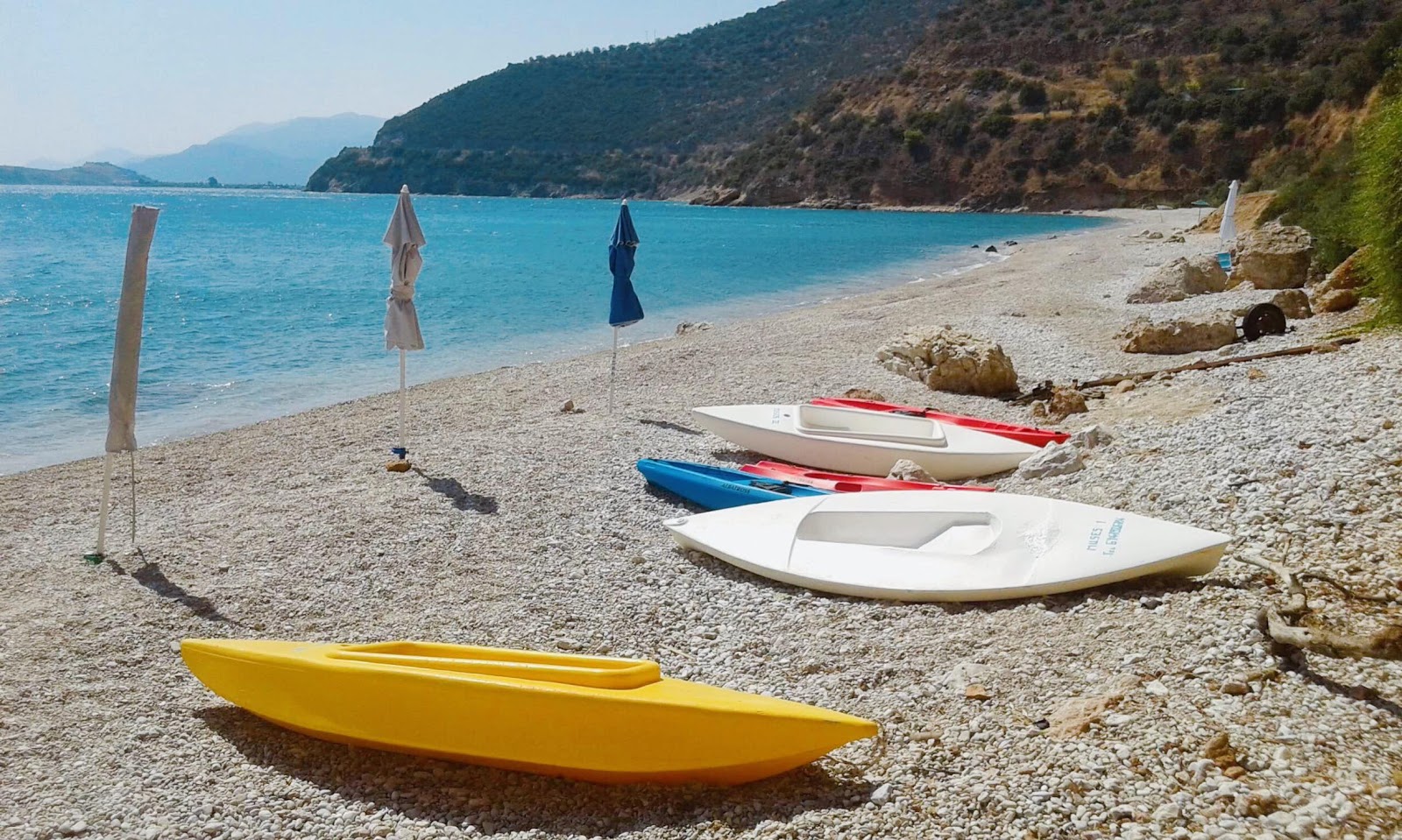 Foto af Muses seaside med turkis rent vand overflade