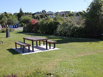 Small park with picnic table, and seating