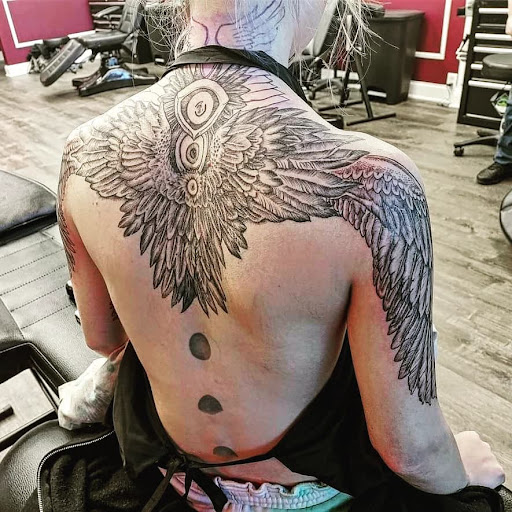 Explore female tattoo design ideas, creative tattoo ideas in Westland, available at Premier Tattoo Company Westland