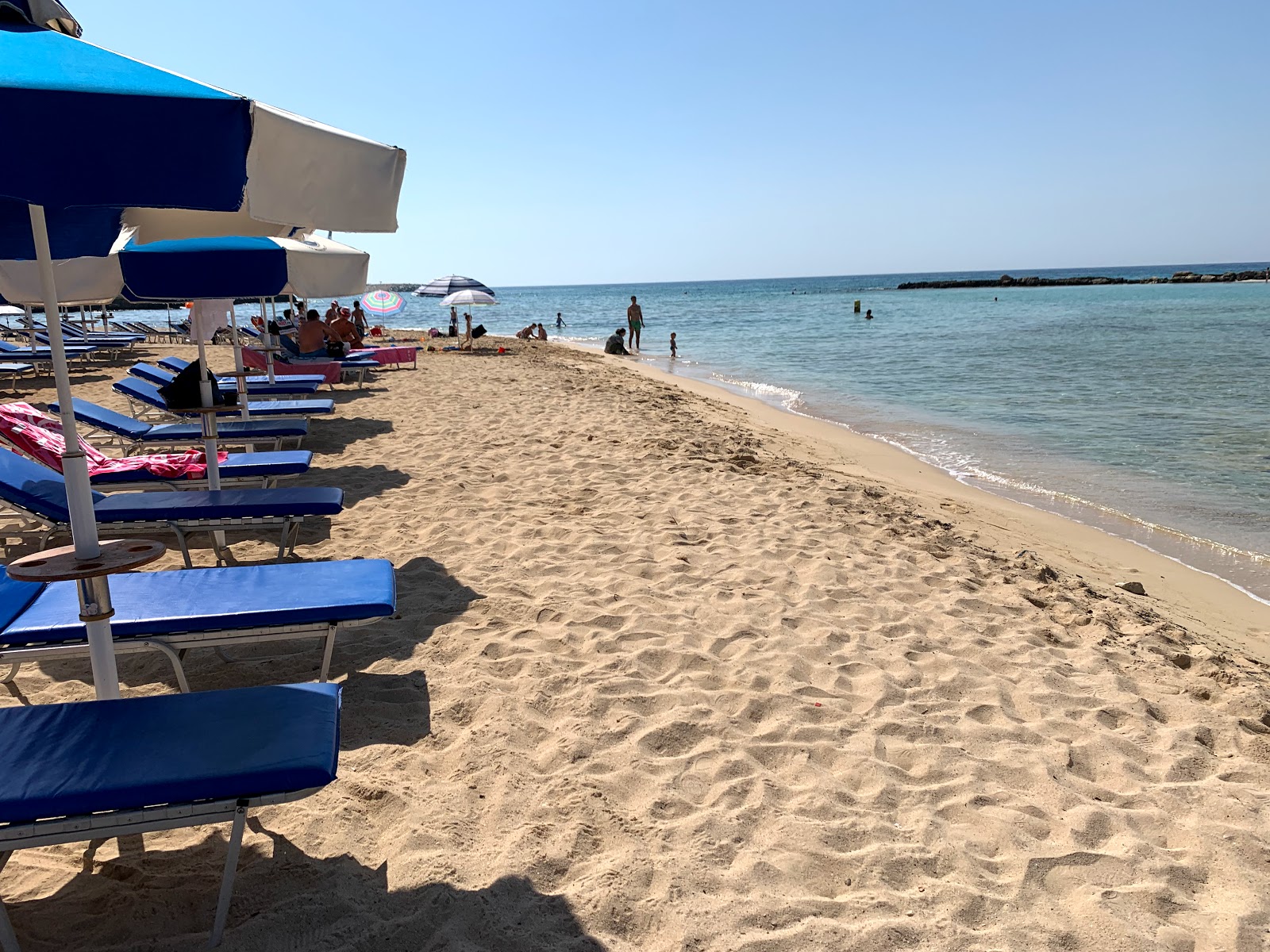 Fotografija Sirens beach z modra čista voda površino