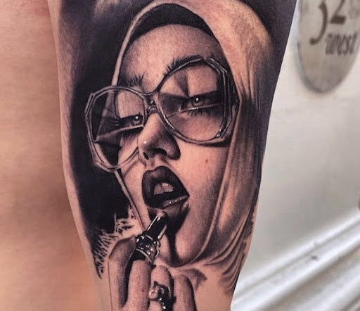 Explore dog tag tattoo ideas, creative tattoo ideas in Los Angeles, available at Surrender Inc. Tattoo