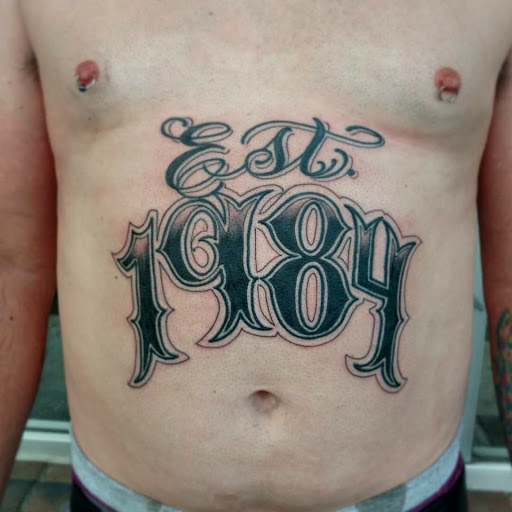 Explore under breast tattoo ideas for females, creative tattoo ideas in Florissant, available at St. Louis Ink