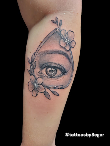 Explore negative space tattoo ideas, creative tattoo ideas in Crystal City, available at Meraki Tattoo and Piercing