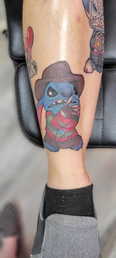 Explore rose tattoo idea, creative tattoo ideas in Ocala, available at The Tattoo Gallery of Ocala LLC