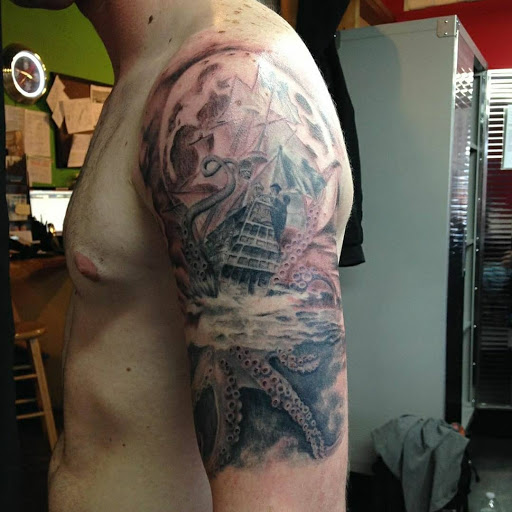 Explore leg sleeve tattoo ideas for women, creative tattoo ideas in Fort Pierce, available at Goodfellas Tattoo & Body Piercing