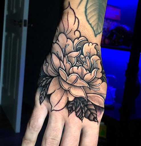 Find music notes tattoo ideas for your next unique tattoo in Tampa at Emphasis Tattoo