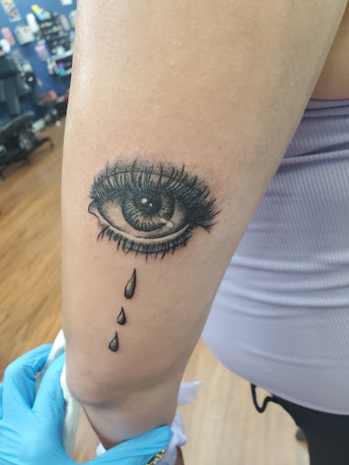 Explore lower arm tattoo ideas, creative tattoo ideas in Cocoa, available at Rorschach Tattoo Shop and Piercing Studio