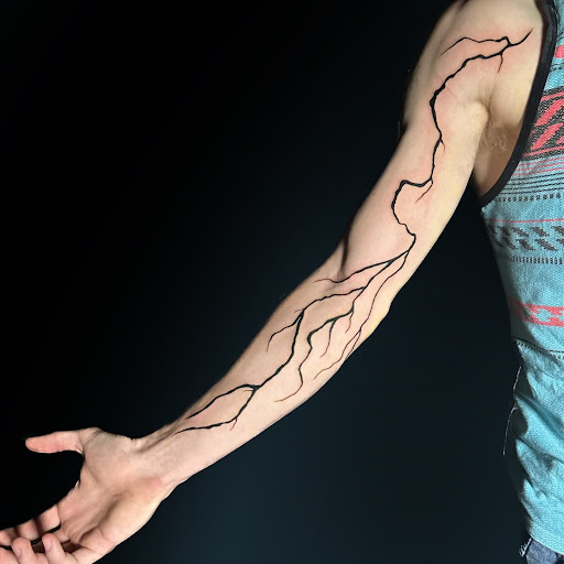 Explore gambit tattoo ideas, creative tattoo ideas in Washington, available at Trilogy Atelier - DC Tattoo Shop Piercing Studio