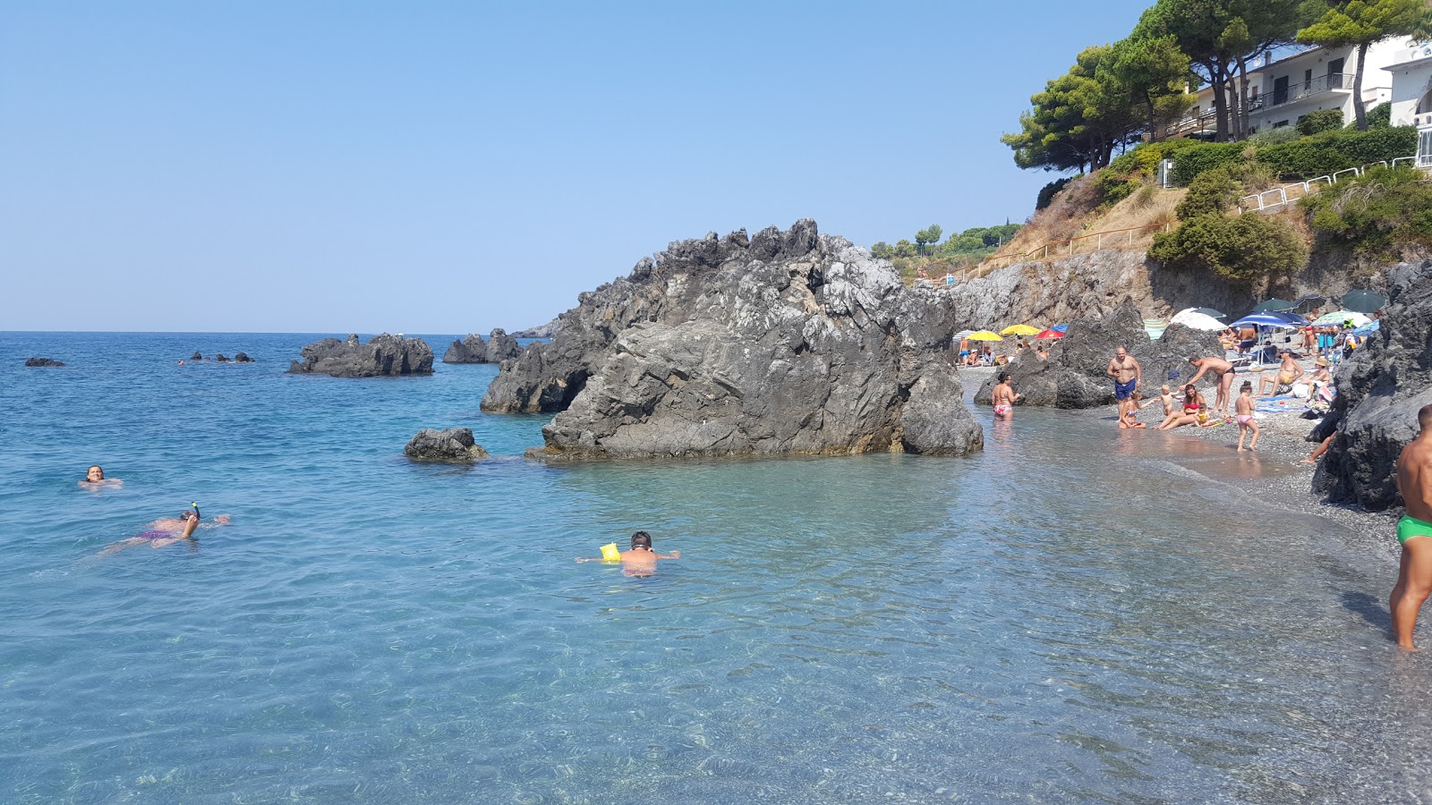 Photo of Scalea Beach backed by cliffs