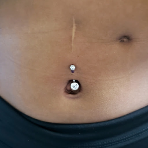 Find tattoos in between breast ideas for your next unique tattoo in Fort Lauderdale at Righteous Ink Tattoo Body Piercing & Supply