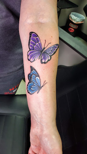 Explore neck tattoo ideas for women, creative tattoo ideas in Centralia, available at Samurai Tattoo