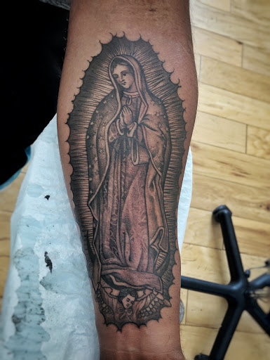 Explore fallen angel tattoo ideas, creative tattoo ideas in Magnolia, available at Mr. Grays Tattoo Studio