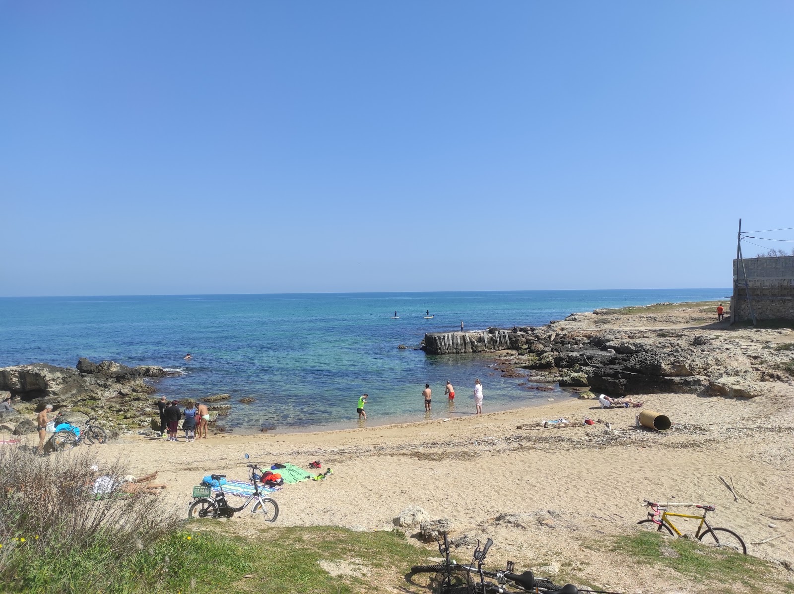 Foto av Cala Settanni beach med blå rent vatten yta