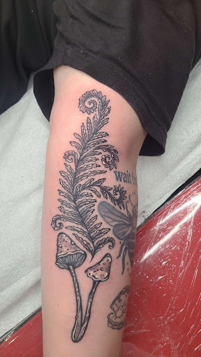 Explore tattoo ideas for women's arms, creative tattoo ideas in Brooklyn, available at Cake Is a Lie Tattoo Parlor