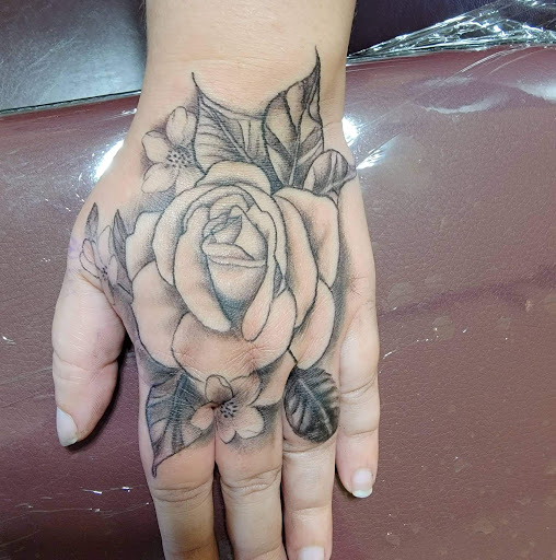Explore black rose tattoo cover up ideas, creative tattoo ideas in North Bend, available at The Rusty Needle Tattoo Parlor