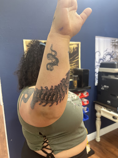 Explore half arm tattoo ideas, creative tattoo ideas in Cocoa, available at Rorschach Tattoo Shop and Piercing Studio