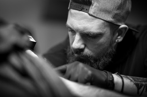 Explore blackout tattoo cover up ideas, creative tattoo ideas in Mentor, available at Cardinal Ink