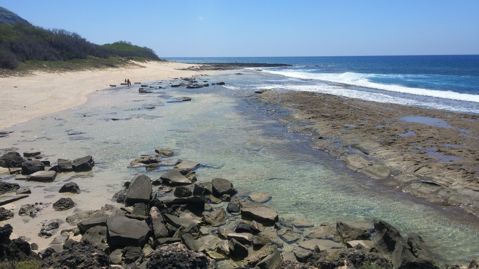 Foto av Ohiki-lolo Beach med turkos rent vatten yta