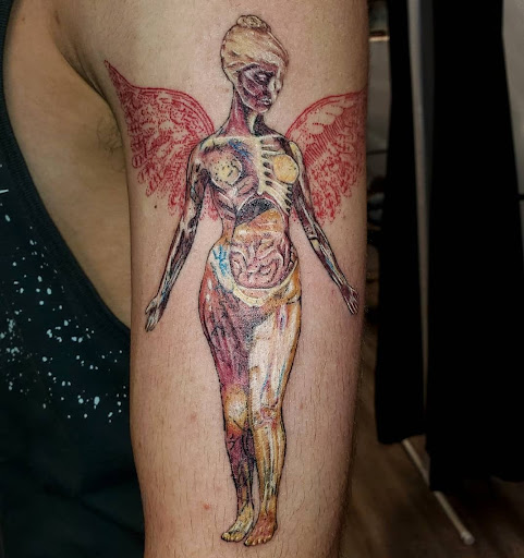 Explore tattoo ideas for shoulder cap, creative tattoo ideas in Galena, available at Emerald Buddha Tattoo