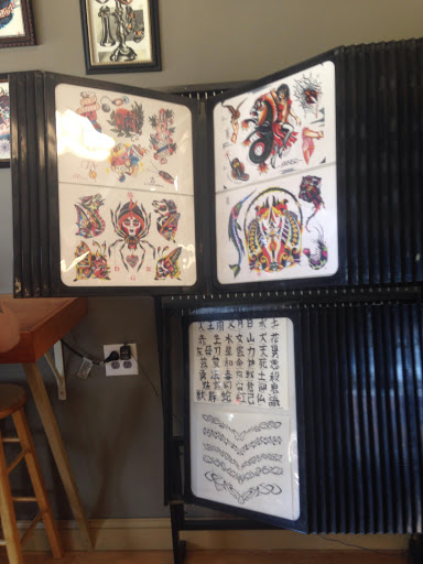 Explore sunflower thigh tattoo ideas, creative tattoo ideas in Huntington, available at Tat-Nice Tattoos