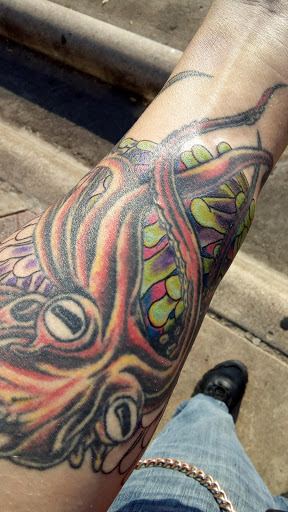 Explore lone wolf tattoo ideas, creative tattoo ideas in Arlington, available at Urbans Tattoo & Piercing Studio