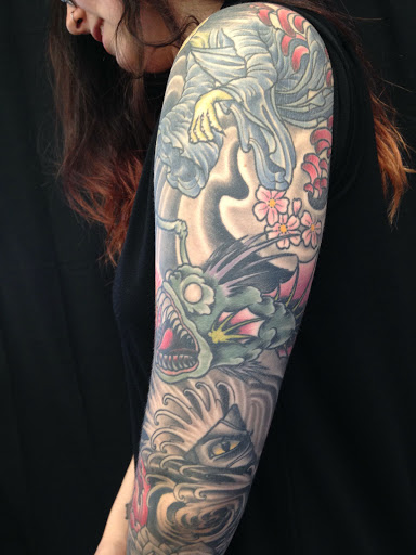 Explore stamp tattoo ideas, creative tattoo ideas in Peoria, available at Iron Key Tattoo Studio Inc.