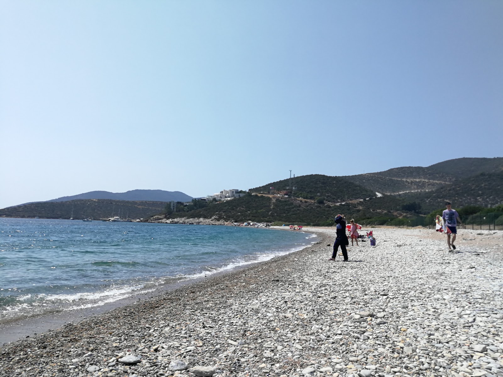 Yaliciftlik beach的照片 带有蓝色纯水表面