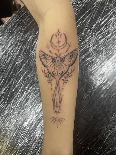 Explore mom tattoo ideas for son, creative tattoo ideas in Cocoa, available at Rorschach Tattoo Shop and Piercing Studio