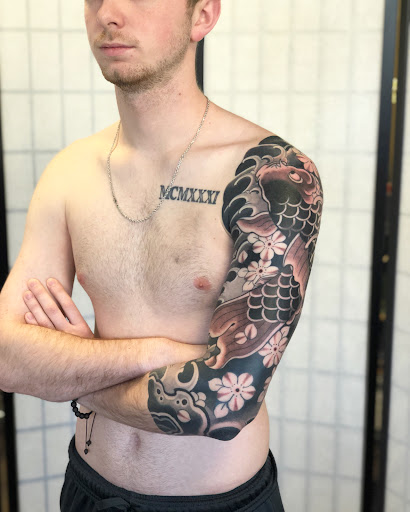 Explore race car tattoo ideas, creative tattoo ideas in Florida, available at Pennyroyal Tattoo
