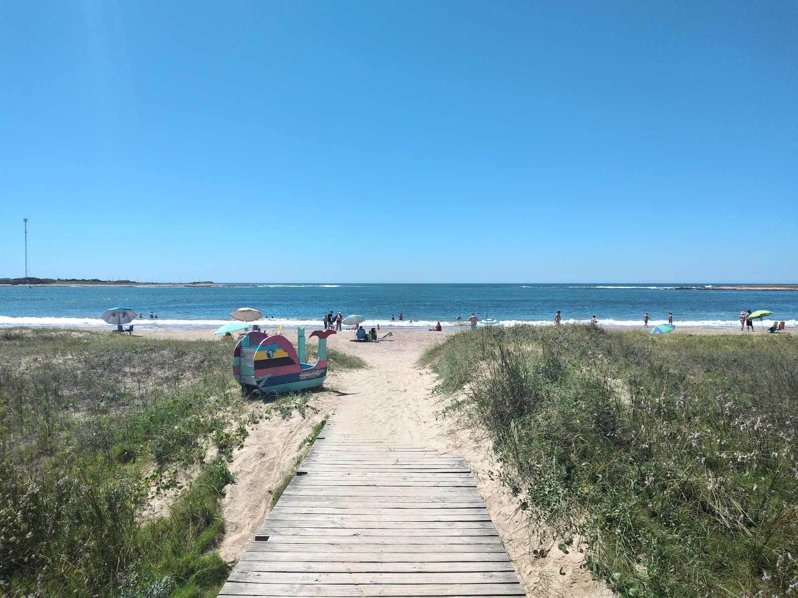 Foto di Bahia Grande Beach con una superficie del sabbia beige