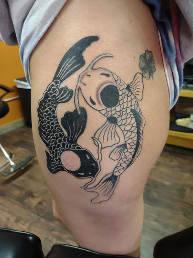 Explore design tattoo ideas for men, creative tattoo ideas in Williamston, available at Inkd Tattoo Parlor