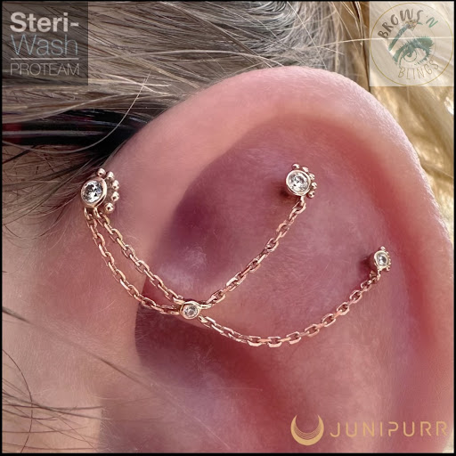 Explore female spine tattoo ideas, creative tattoo ideas in Bellefonte, available at Hocus PokeUs Piercing Studio (formally Brows n Blings)