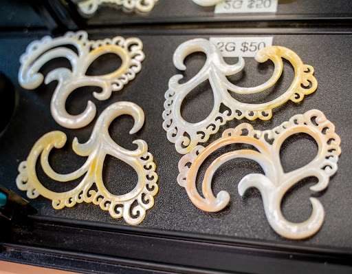 Explore 100 dollar bill tattoo ideas, creative tattoo ideas in Charleston, available at Exotic Impressions Body Piercing