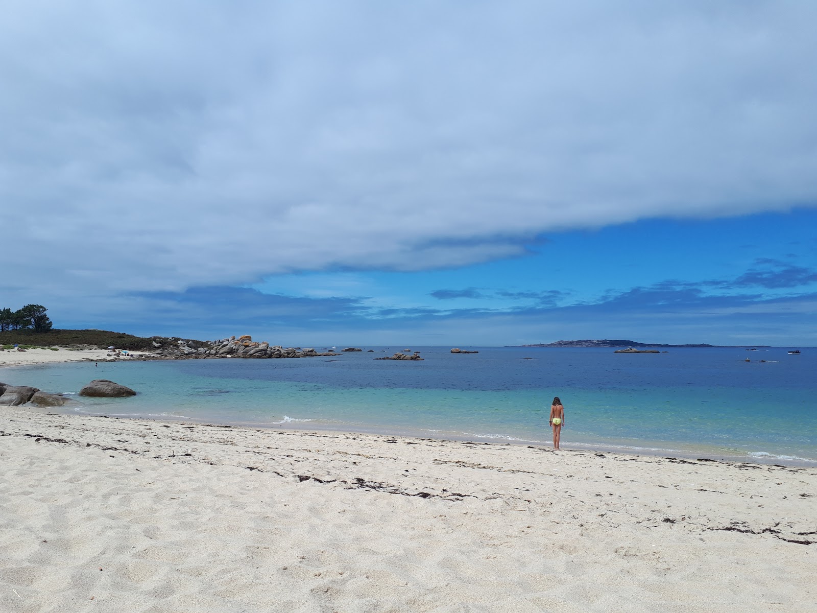 Foto av Castineira beach med vit fin sten yta