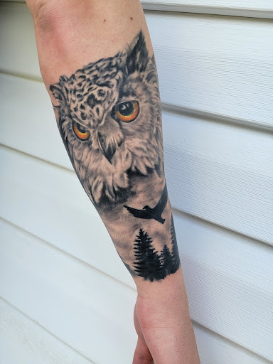 Explore bass tattoos ideas, creative tattoo ideas in Clinton, available at Heartland Tattoo Company