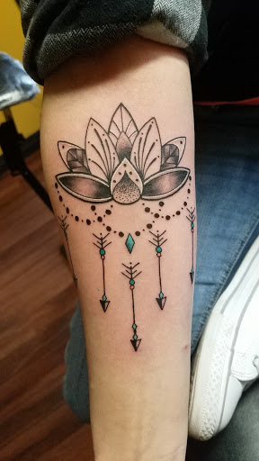 Find halo tattoo ideas for your next unique tattoo in Cheyenne at The T.R.I.B.E. Zoo, LLC Tattoo