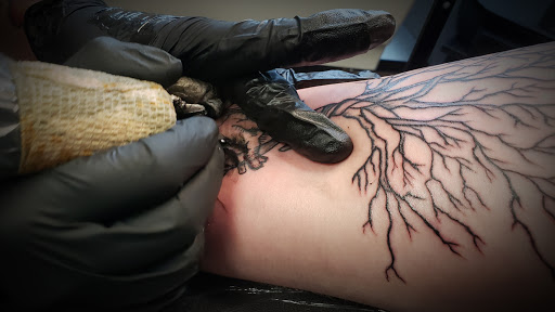 Explore front neck tattoo ideas, creative tattoo ideas in Minocqua, available at Whisky Rose Tattoo Parlor