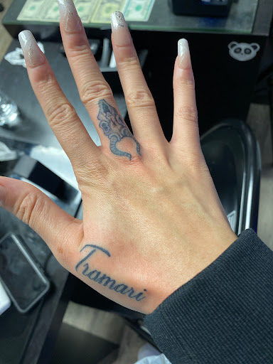 Find tattoo ideas under breast for your next unique tattoo in Mattapan at Famous Touch Tattoos