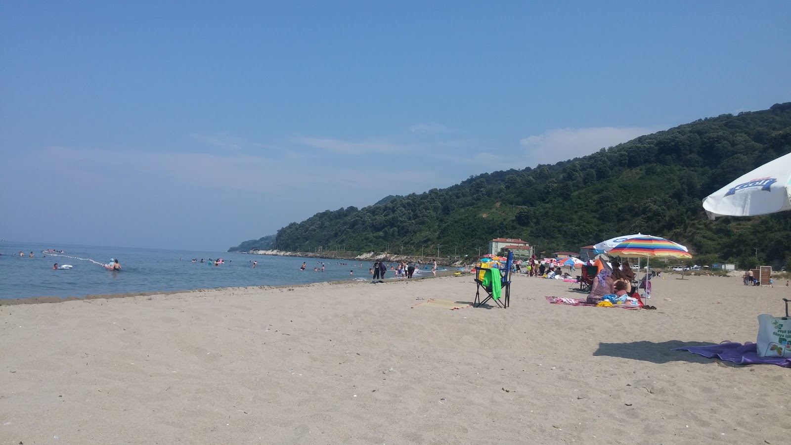 Foto di Kursunlu Mahalle Plaji con una superficie del sabbia beige