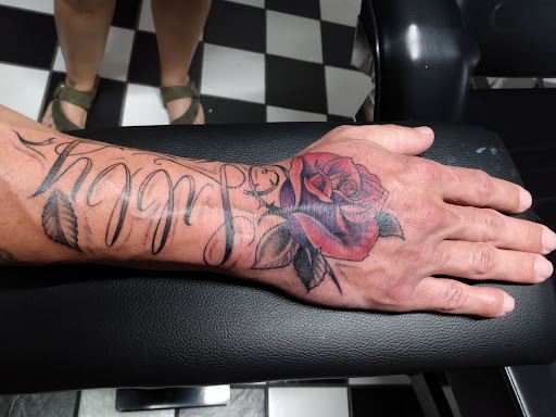 Explore hand tattoo ideas female, creative tattoo ideas in Rogers, available at 3rd Eye Tattoo