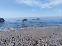 Foto von Playa de las Yucas und die siedlung