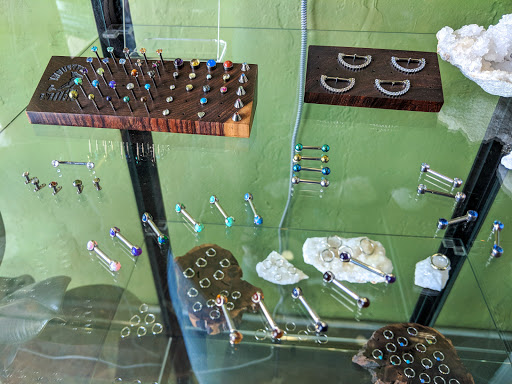 Explore family tree tattoo ideas for men, creative tattoo ideas in Long Beach, available at Somatic Body Piercing