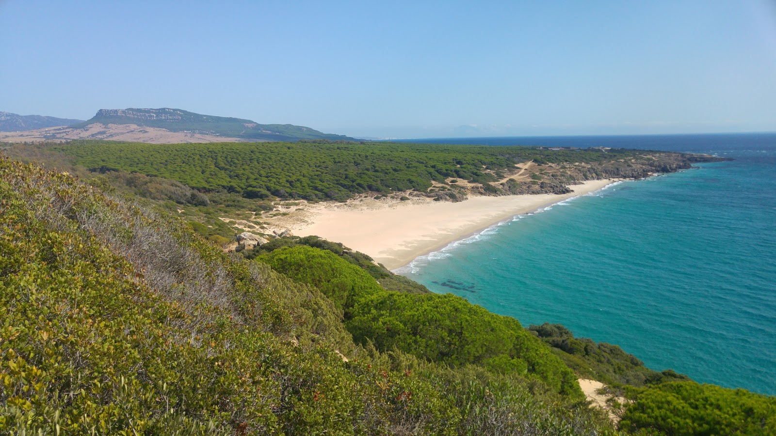 Foto de Praia do Canuelo com areia fina e brilhante superfície
