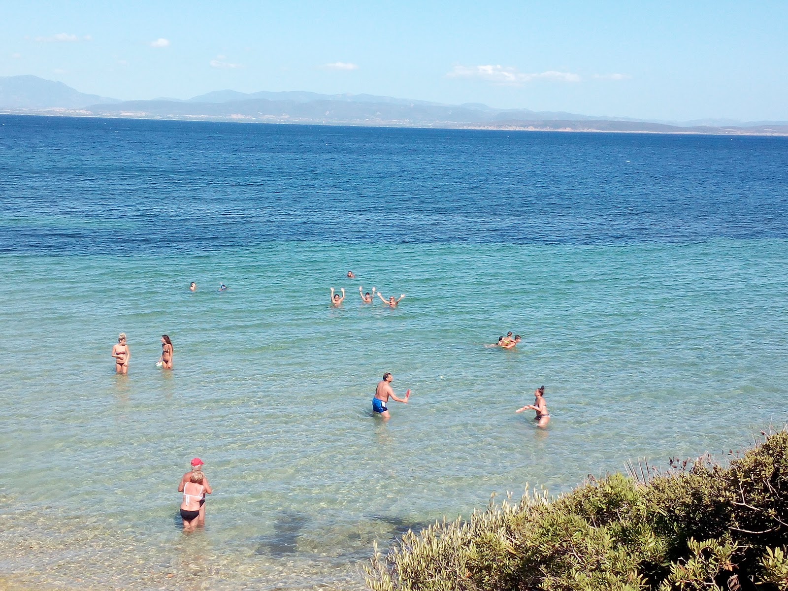 Portixeddu beach'in fotoğrafı küçük koy ile birlikte