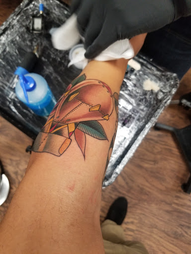 Find tattoo ideas for new moms for your next unique tattoo in Denton at Dark Age Tattoo Studio