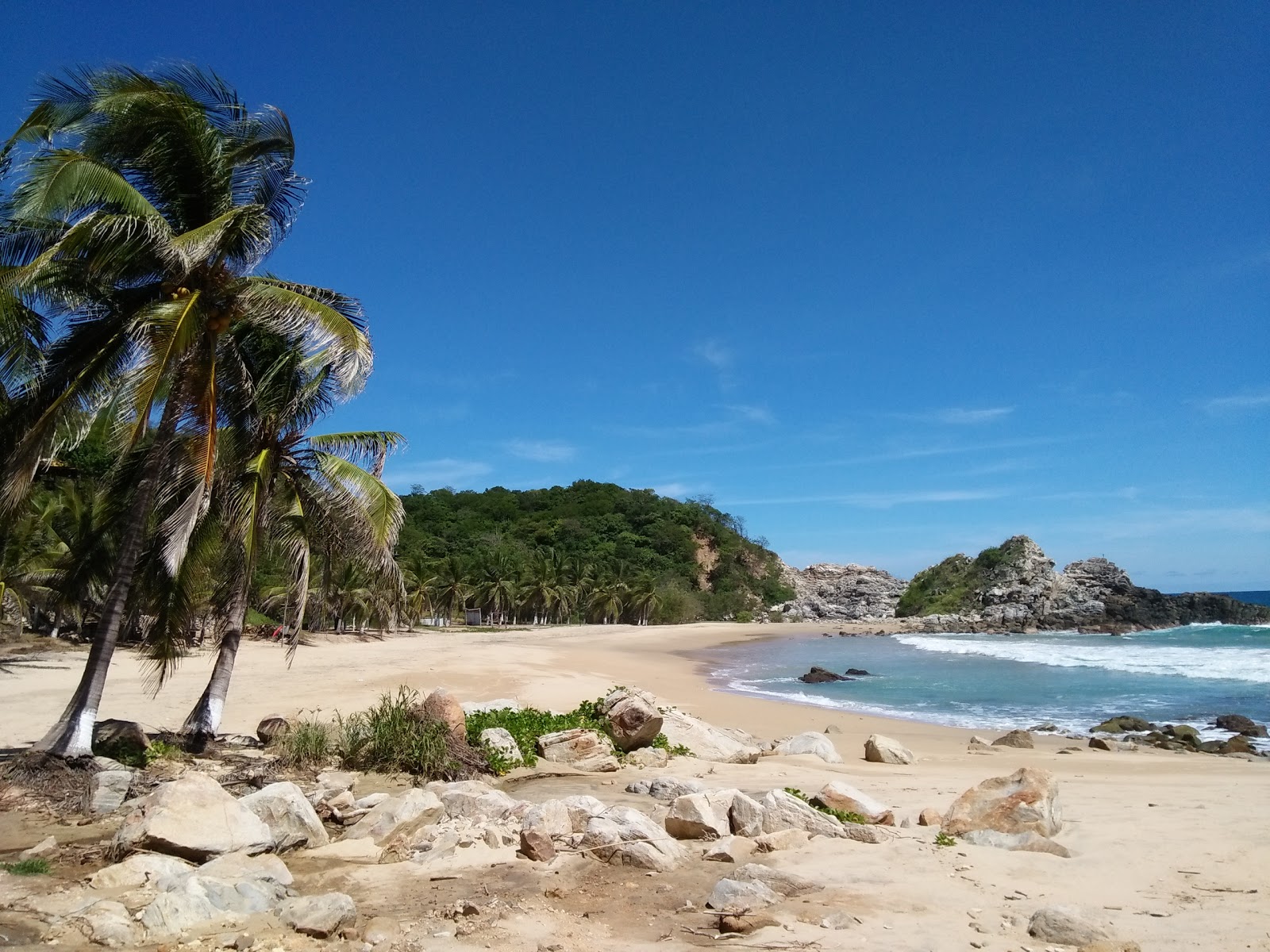 Foto di Tembo beach con una superficie del sabbia fine e luminosa